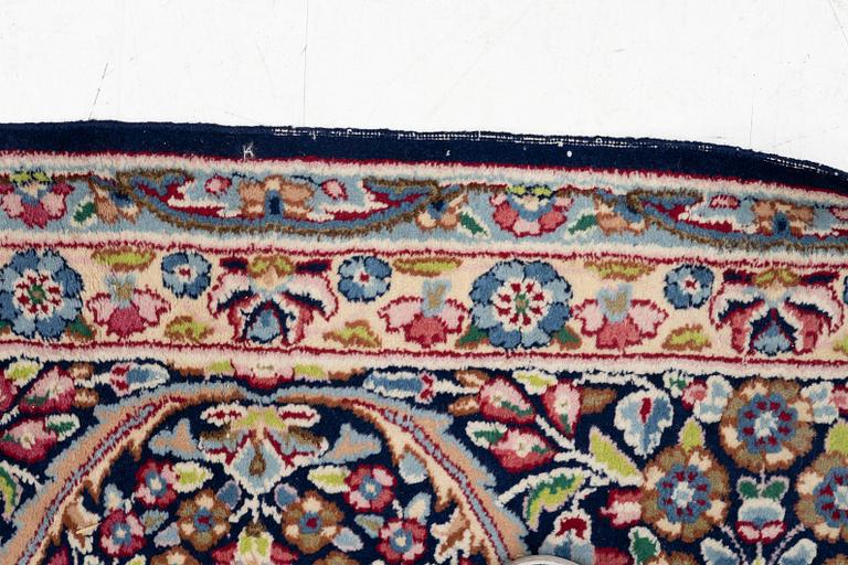An oriental carpet, c. 385 x 300 cm.