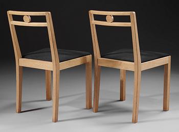 A pair of Axel-Einar Hjorth white chalked oak chairs 'Dagmar' by NK, Sweden 1935.