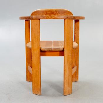 A 1960/70s pine armchair.