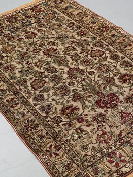 A carpet, an antique silk metal brocaded Kashan, probably around 1910, ca 200-202,5 x 129-131 cm.