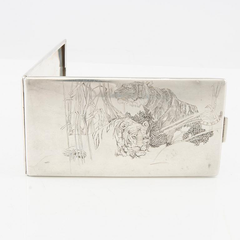 American silver cigarette case with engraving from World War II.
