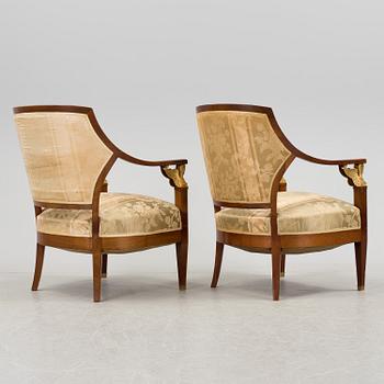 A pair of early 20th century Empire style armchairs.