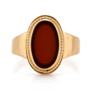 A signet ring set with carnelian.