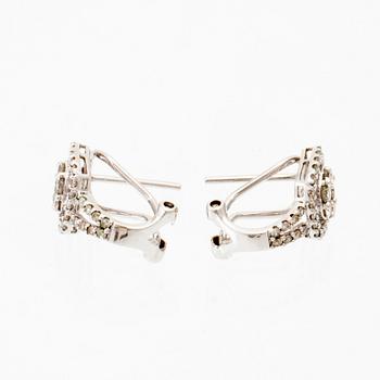 A pair of 14K white gold earrings set with round brilliant-cut diamonds.