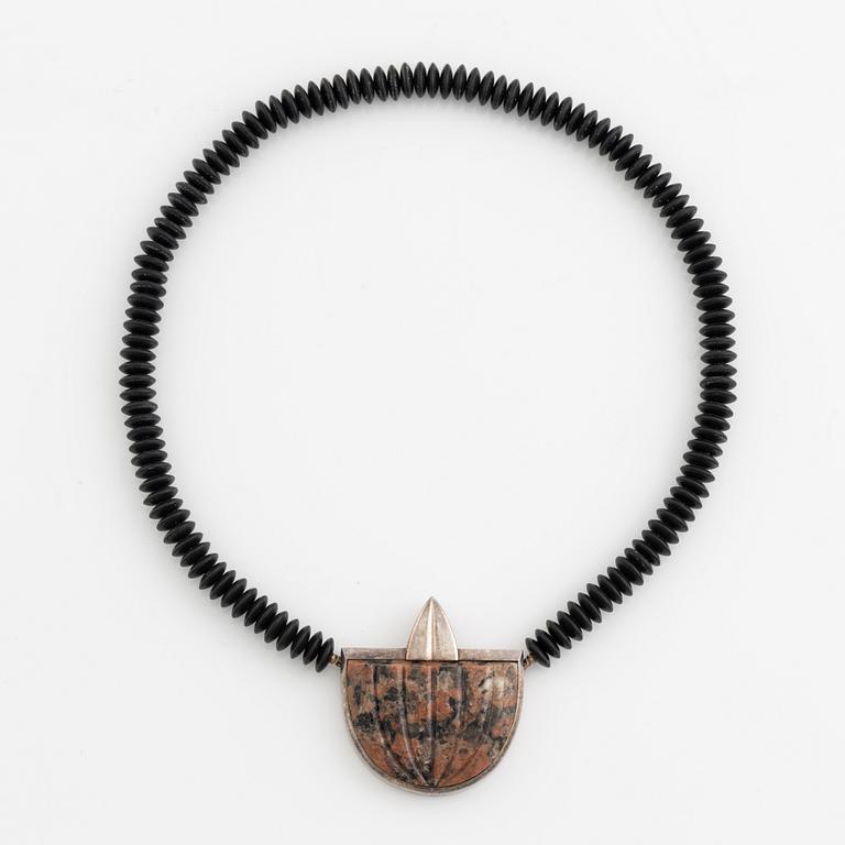 Gaudy necklace, silver and carved stone.