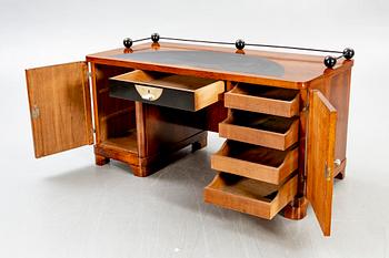 An Art Deco walnut desk.