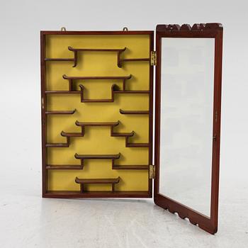 A wall-hanged display cabinet, China, second half of the 20th century.