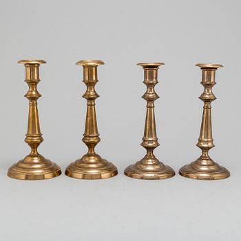 Four (2+2) brass candle holders, including Skultuna.