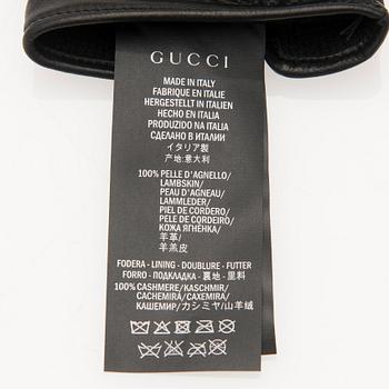 A pair of Gucci ladies' leather gloves.