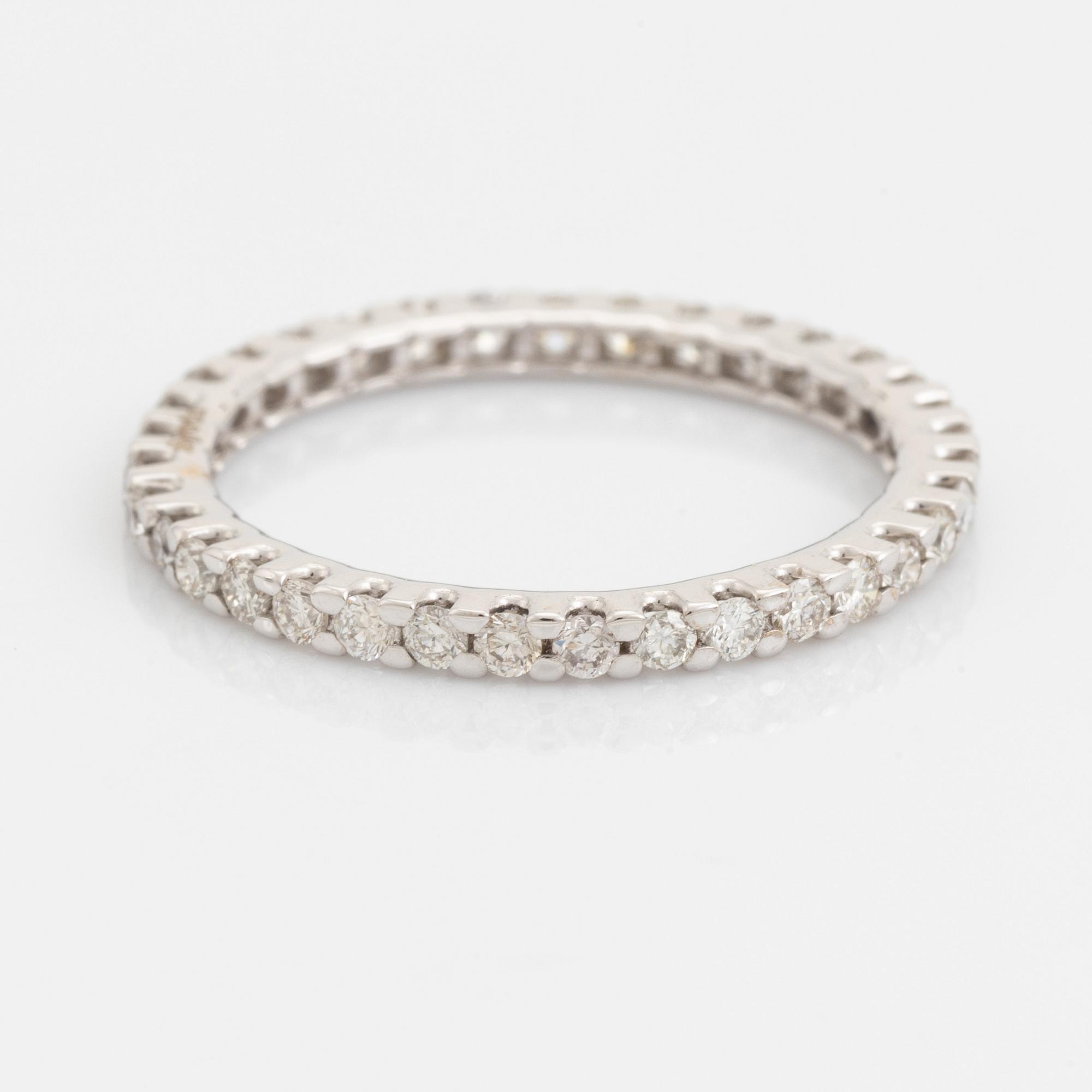Brilliant-cut diamond eternity ring.