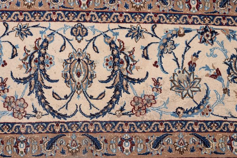 A Nain part silk carpet, c. 535 x 340 cm.
