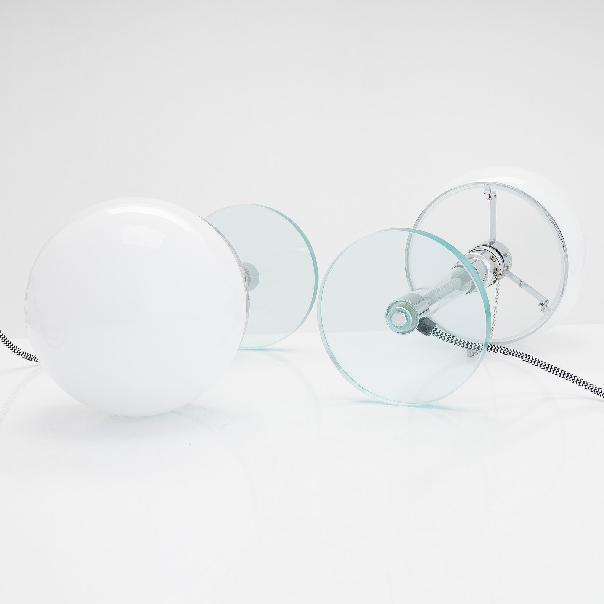 Wilhelm Wagenfeld, a pair of Bauhaus style 'WG24' table lights, Egoluce, Italy, 2000s.