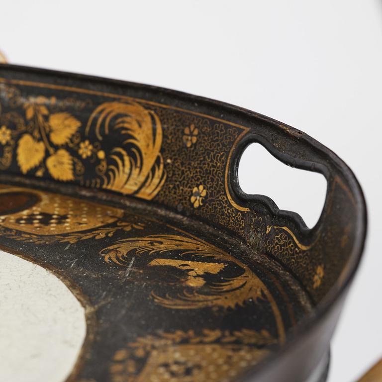 A tole-peinte Empire tray, first part 19th century on a later stand.