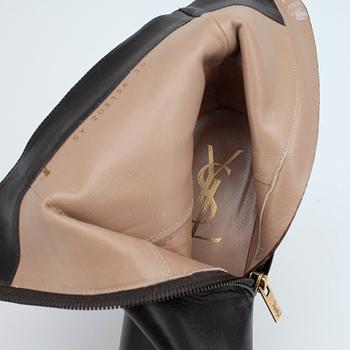 YVES SAINT LAURENT, a pair of brown leather wedge heeled platform boots.