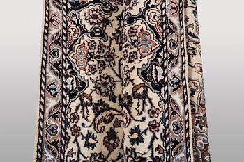 A rug, Nain, part silk, ca 196 x 120 cm.