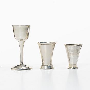 A Swedish silver cup and two beakers.