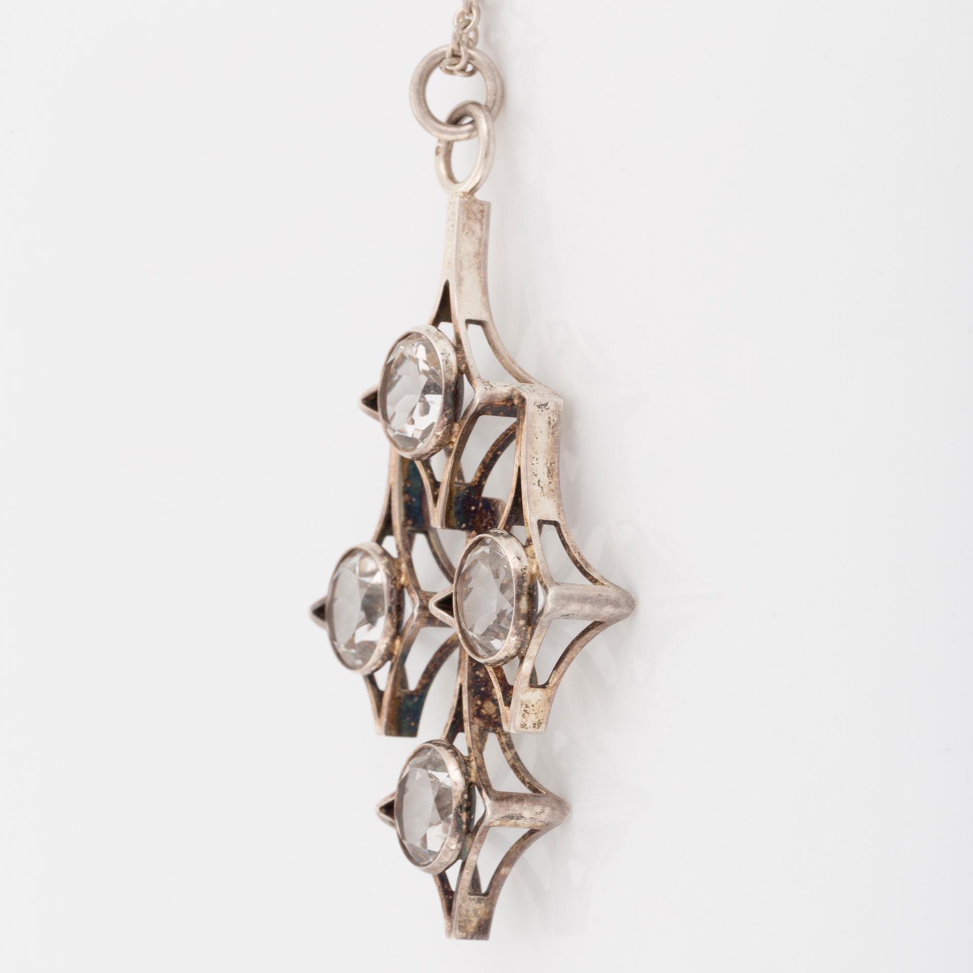 Kultasepät Salovaara, sterling silver bangle and pendant with rock crystal and syntehtic white spinel.