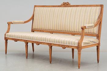 A Gustavian 18th century suite of furniture comprising a pair of armchairs and a sofa.