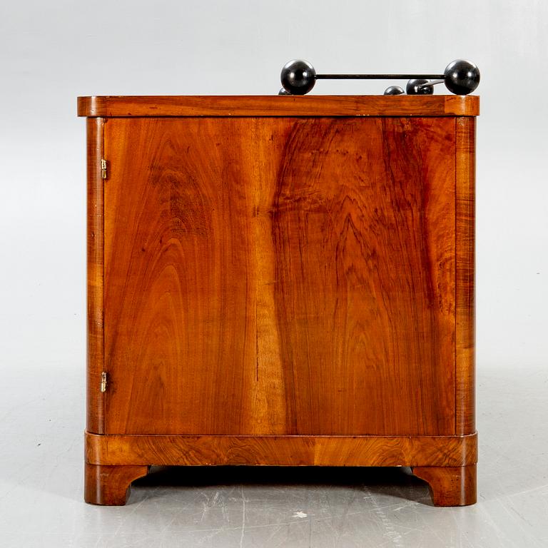 An Art Deco walnut desk.