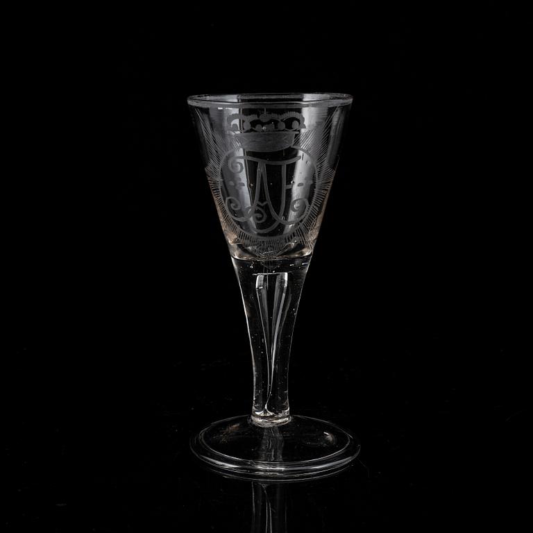 A wine glass with the monogram of the Swedish king Adolf Frederick, 18th Century.