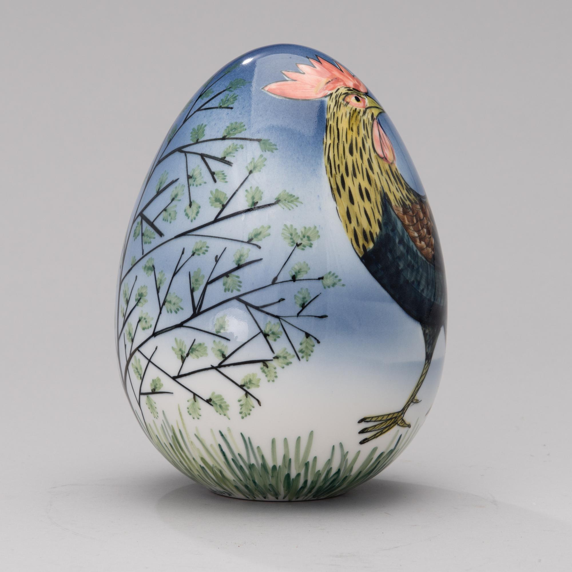 A porcelain egg signed GOG Arabia Finland.