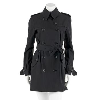 532. BURBERRY, a black cottonblend ladies trenchcoat. UK size 10.