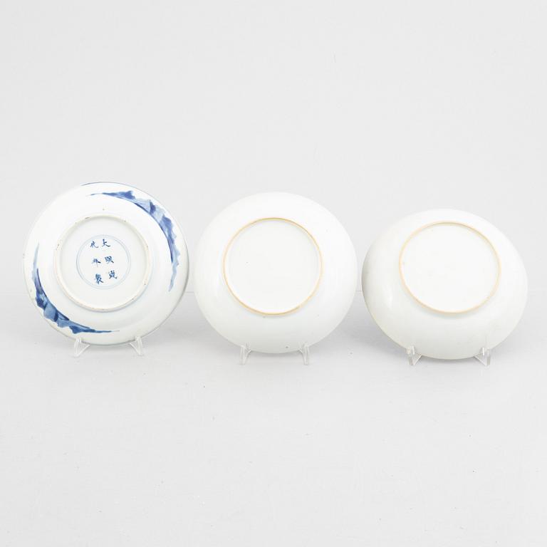 Three small porcelain plates and a cup with saucer, China, 18th century, and an English 19th century cup with saucer.