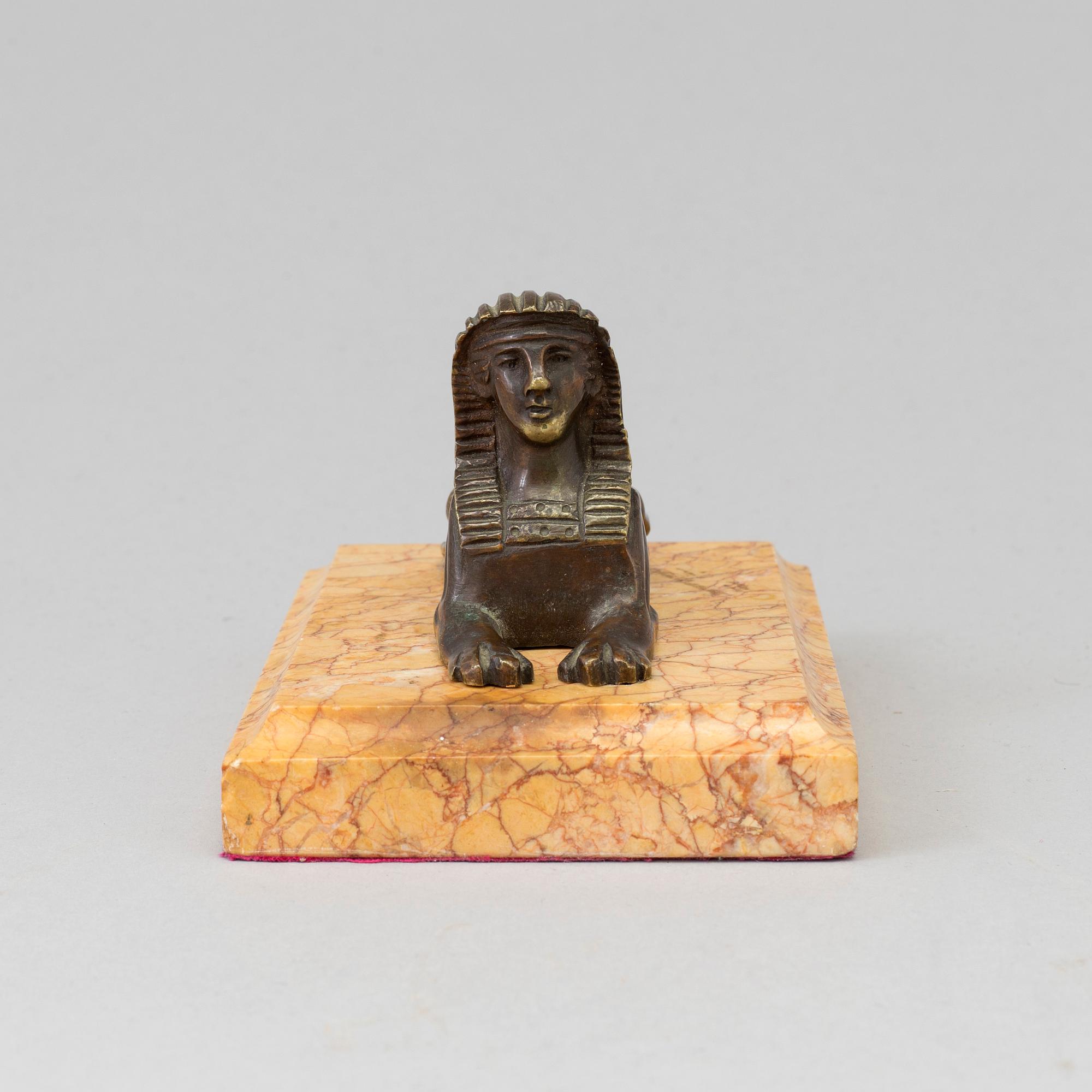 AN EMPIRE  BRONZE AND MARBLE PAPER WEIGHT, early 19th century.