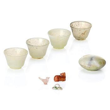 A set with four green stone cups, a small box with cover and three miniature objects, China, early 20th century.