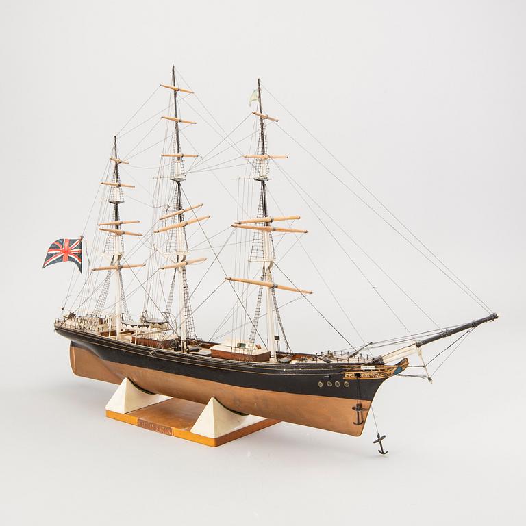 A model ship dated 1957 "Cutty Sark".