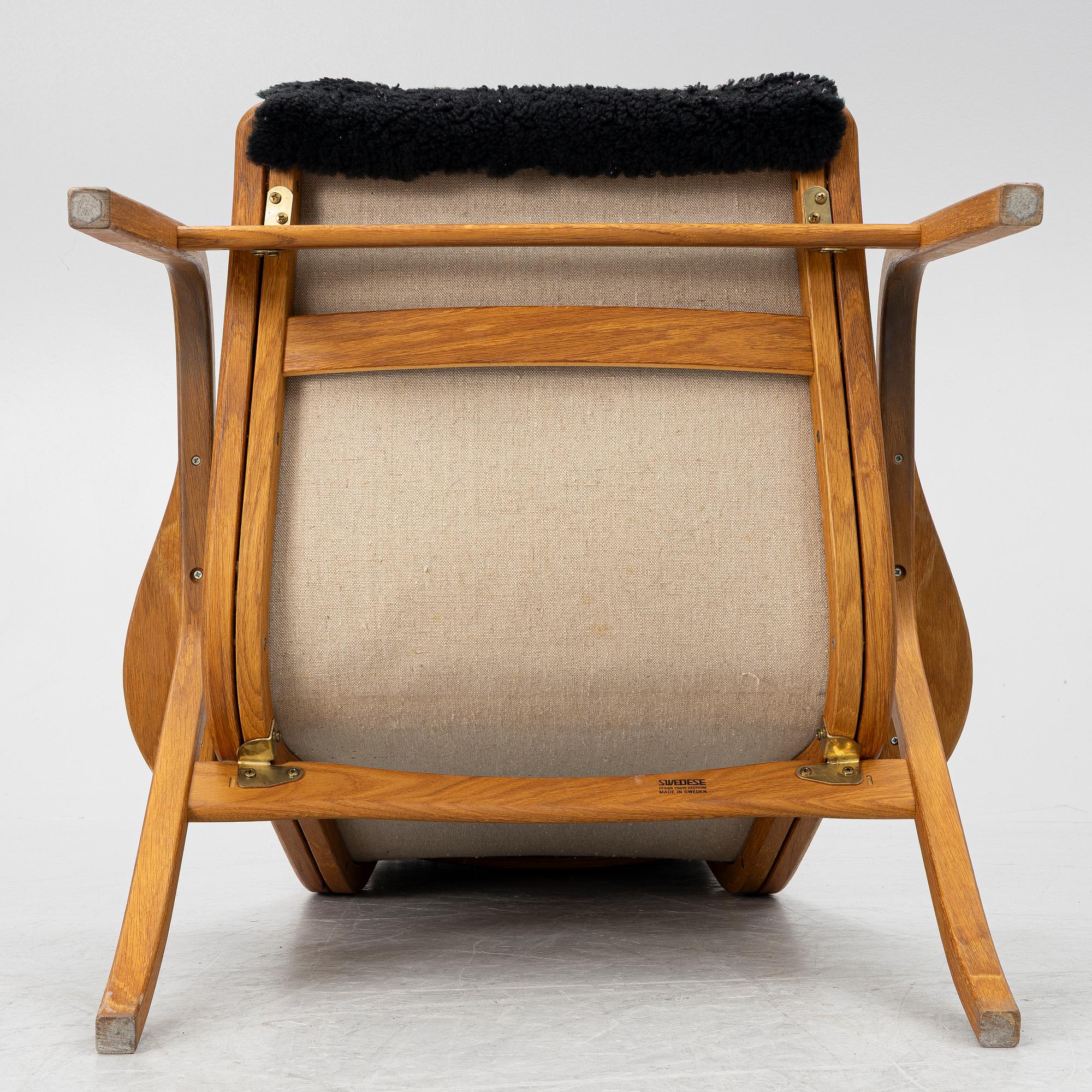 Yngve Ekström, a 'Lamino' armchair and sidetable, Swedese, Sweden, early 21st century.