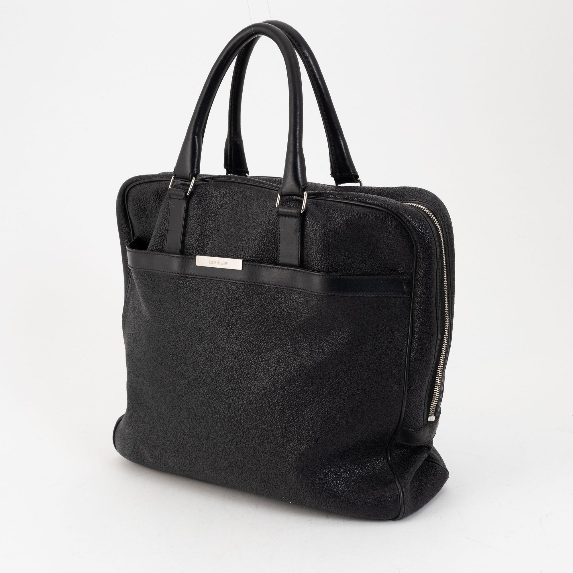 Christian Dior, a black leather briefcase.