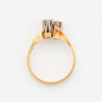 Brilliant-cut diamond cross over ring.