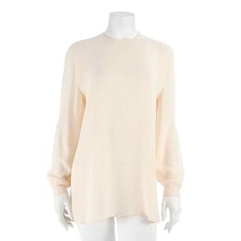 318. GIORGIO ARMANI, a créme colored silk blouse, size 42.