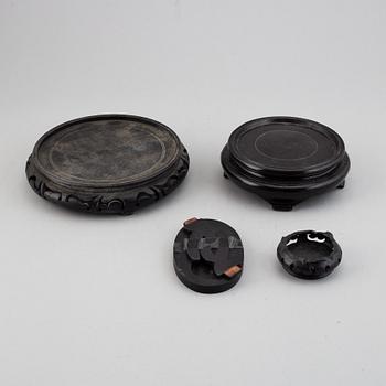 19 Chinese wooden stands, 20th century.