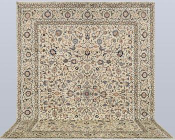A Keshan carpet, signed, approx. 410 x 323 cm.