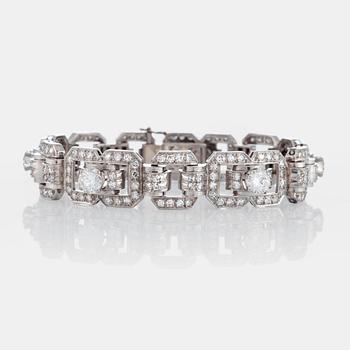 A platinum bracelet set with round brilliant- and eight-cut diamonds.