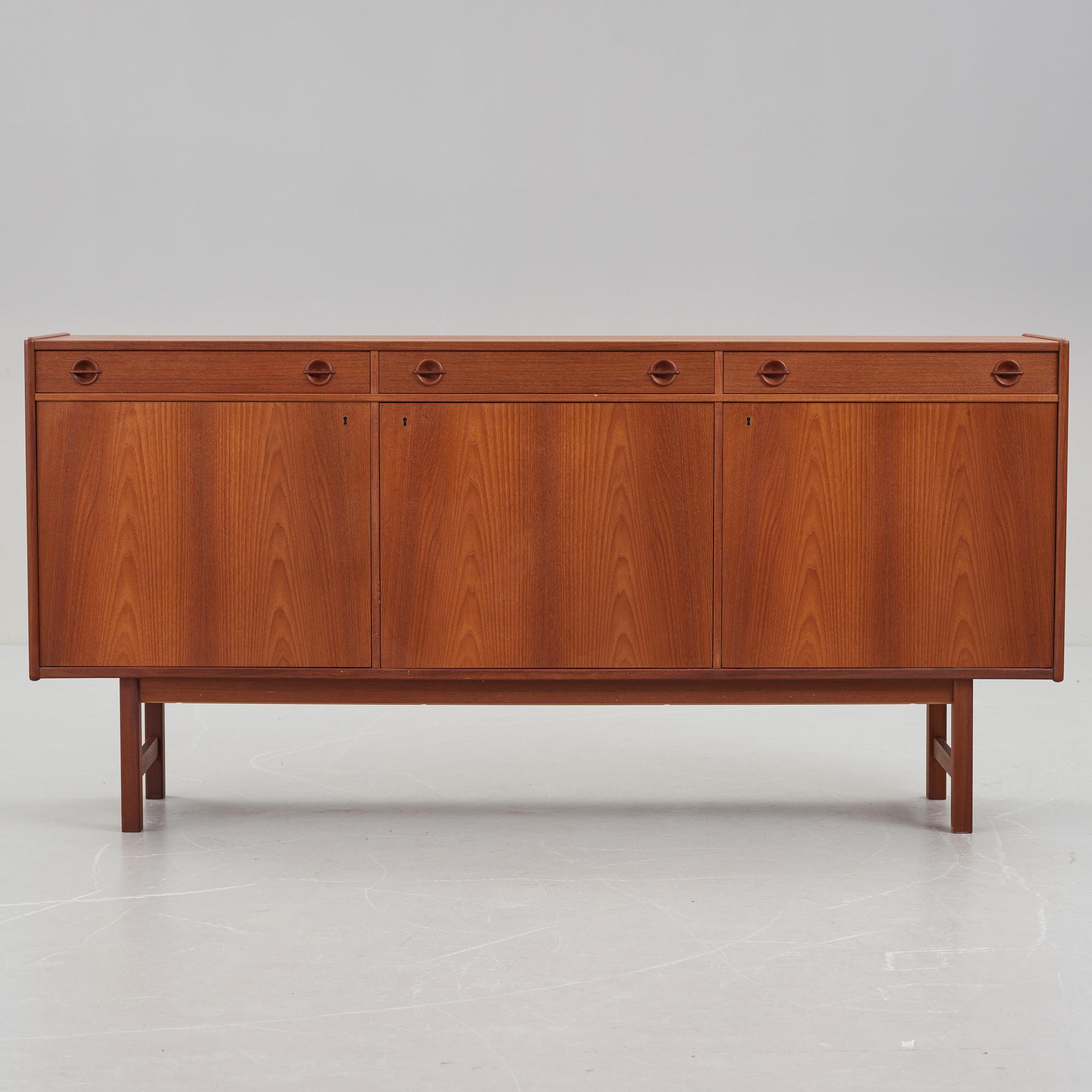 A late 20th Century teak veneered sideboard.