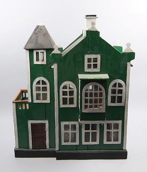 DOCKSKÅP MED MÖBLER, ca 20 delar, trä, 1900-talets första hälft.