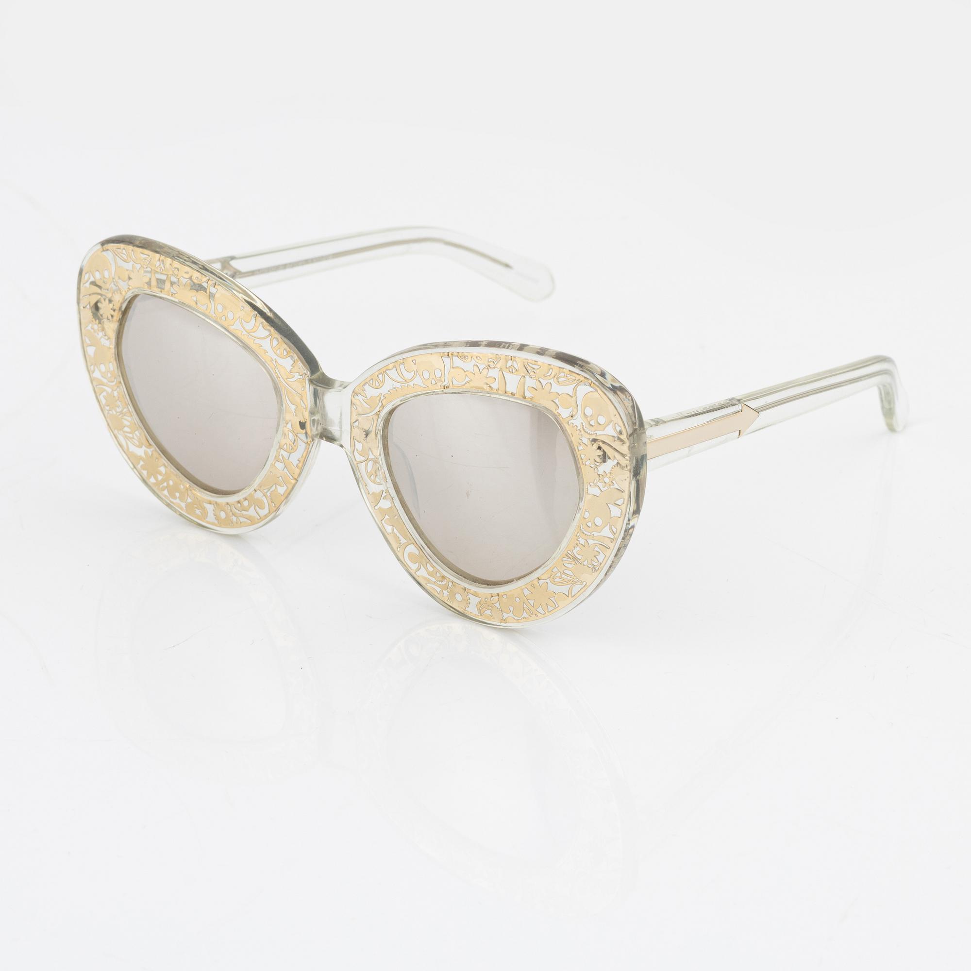 Karen Walker, a pair of "Intergalactic" sunglasses.