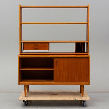 A 1960s teak veneered shelf.