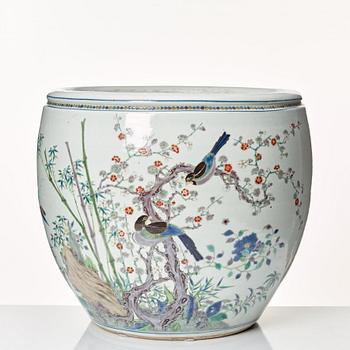 A large famille rose fish bowl, late Qing dynasty, circa 1900.