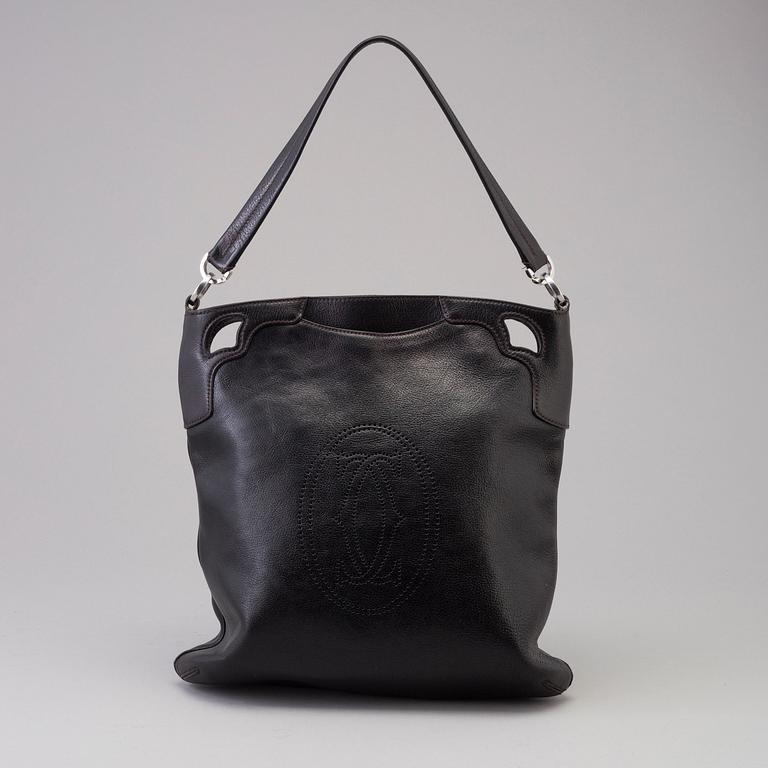 A bag "Marcello Reporter" by Cartier.