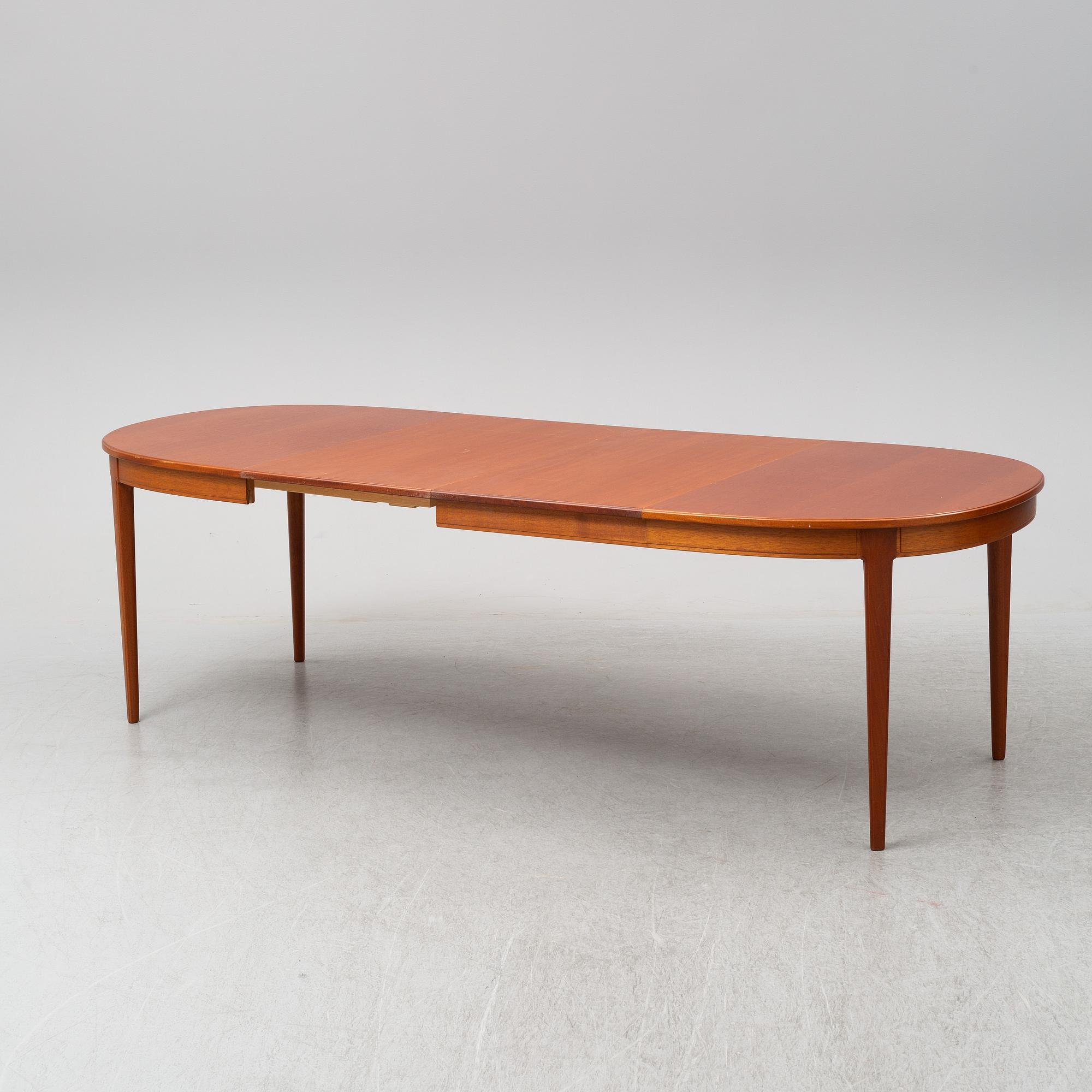 CARL MALMSTEN, A 'Herrgården' table with six chairs and two leaves.