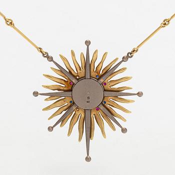 Pendant, faceted sapphires, rubies and diamonds, iron ore, 18K gold and white gold.