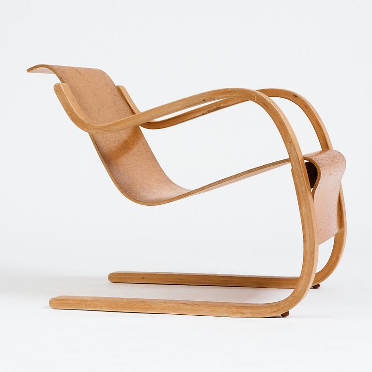 Alvar Aalto, a model 31 burled birch armchair, produced by O.y Huonekalu-ja Rakennustyötehdas, Finland or Aalto Design Hedemora.