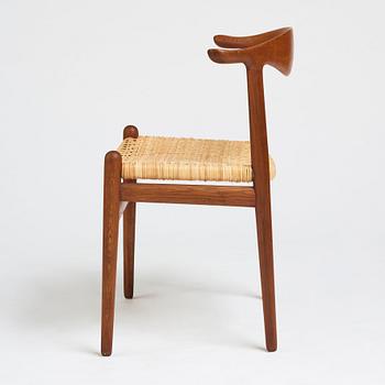 Hans J. Wegner, a teak, oak and cane "Cowhorn chair", JH 505, Johannes Hansen, Denmark 1950-60's.