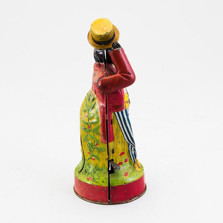 A tinplate coin bank by J. Levy & Co, England, probably of German manufacture, ca 1909.