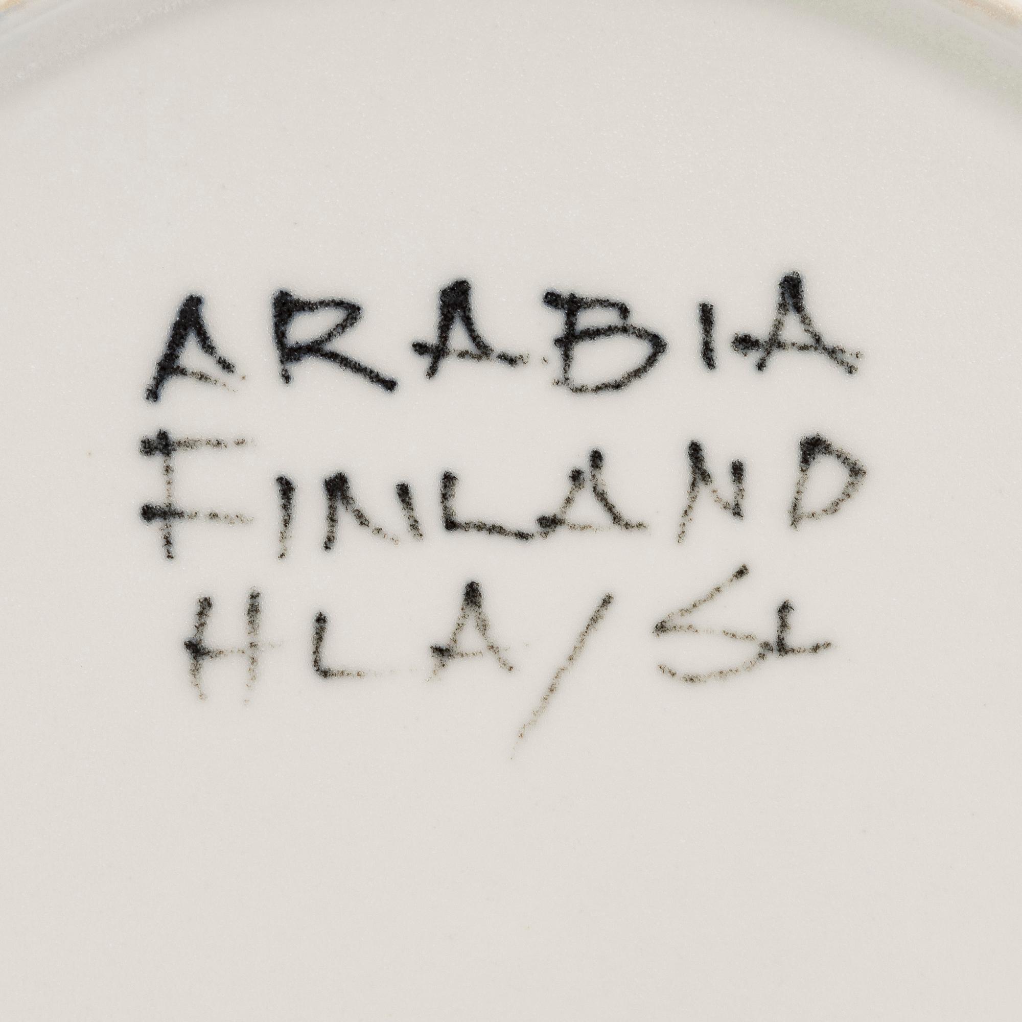 Hilkka-Liisa Ahola, a ceramic serving dish and ten side plates, signed HLA, Arabia Finland.