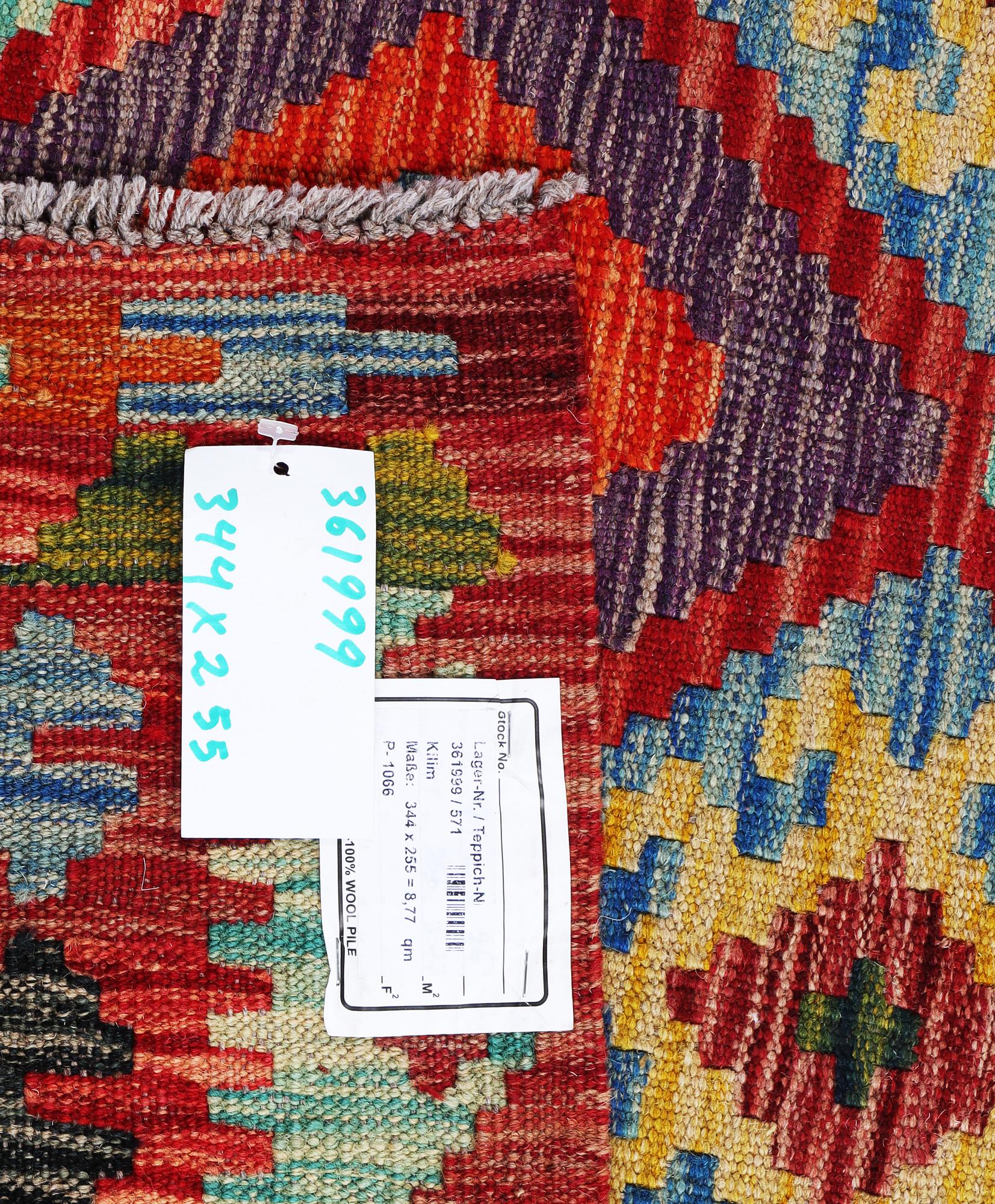A Kilim carpet, c. 344 x 255 cm.